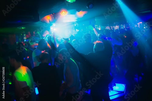 crowd of people dancing in nightclub