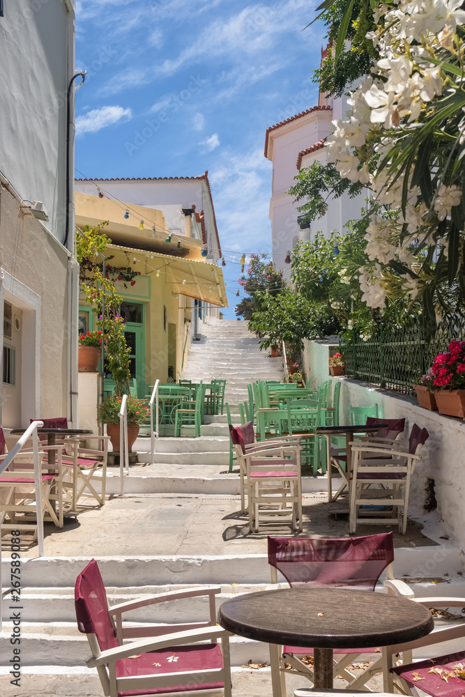 Obraz premium Cozy outdoor cafes in Chora town on Andros island, Cyclades