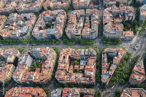 Aerial view of Barcelona buildings, high angle view of the city typical urban grid, Spain