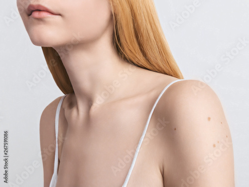 Skin protection Photo template Young blonde woman with pure smooth skin Cropped close-up image of the female neck and shoulders