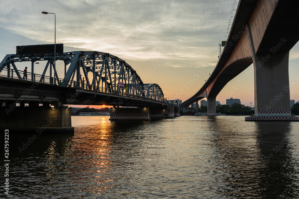 Bridge across Chao Phraya River in the beautiful evening, Twilight time Bnagkok, Thailand. (Krung Thep Bridge)