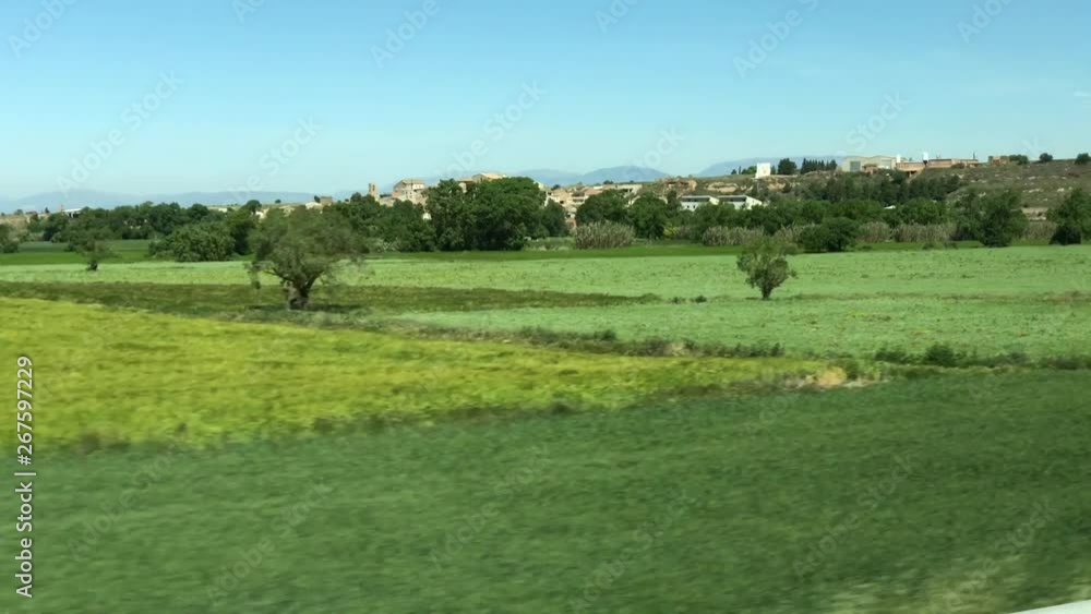 View of Catalonian nature and town from window of bus going from Barcelona to Andorra View of Catalonian nature and town from window of bus going from Barcelona to Andorra