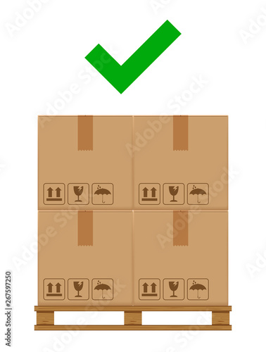 crate boxes on wooded pallet and check mark green for product arrangement concept, stack cardboard box in factory warehouse storage, cardboard parcel boxes packaging cargo brown isolated on white