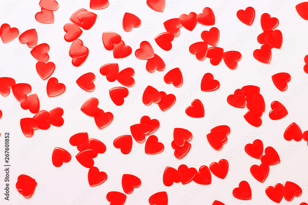 Red hearts confetti and white frame close up, romance concept, copy space