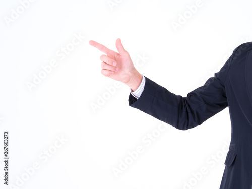 Business man's hand pointing: Copy space at his hand