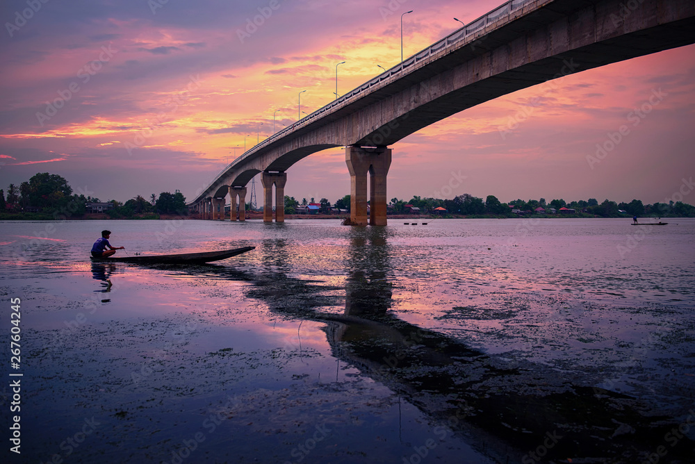 Fototapeta premium fisherman wite boat Morning time at Laos