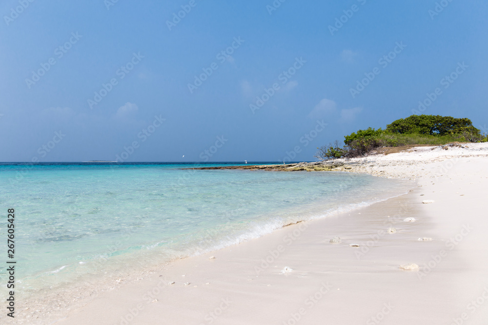 Small island in the Maldives surrounded by perfect crystal clear turquoise water Small island in the Maldives surrounded by perfect crystal clear turquoise water
