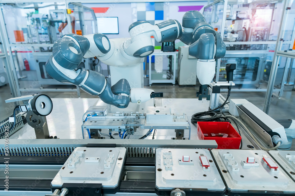 robotic arm catch for electronic assembly line. The robot for smart technology manufacturing process. robotic arm catch for electronic assembly line. The robot for smart technology manufacturing process.
