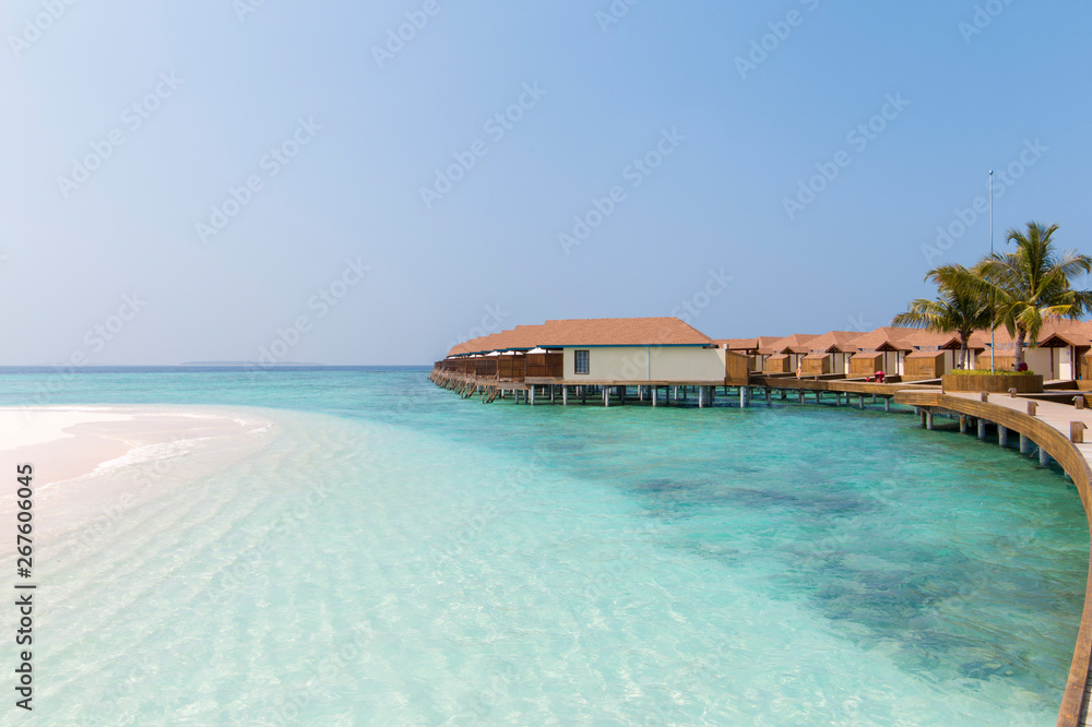 Water bungalows in crystal clear water in the Maldives
