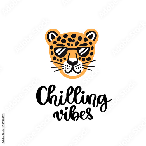 Handwritten phrase: Chilling vibes. Leopard with glasses smiling. It can be used for card, brochures, poster, flyer, t-shirt, promotional materials.