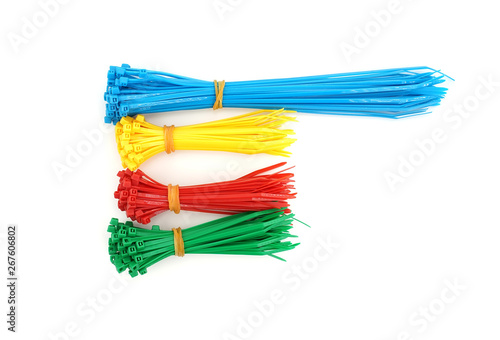 Different colors of plastic nylon cable ties closeup on white background