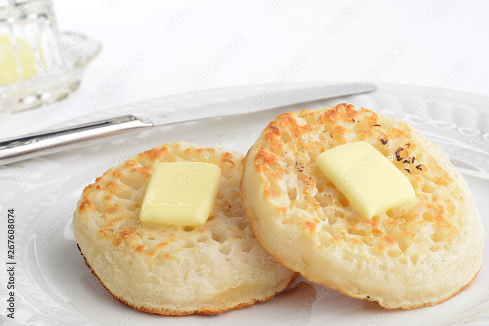 closeup english crumpets with a knife closeup english crumpets with a knife
