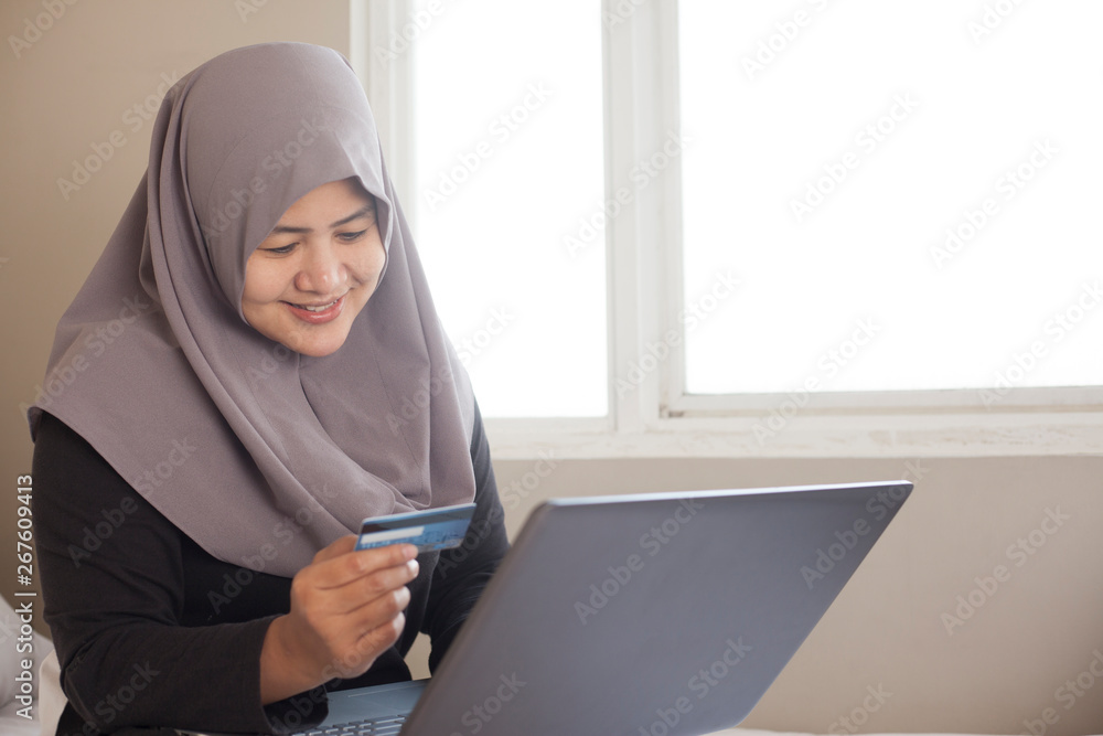 Muslim Woman Making Online Purchase Muslim Woman Making Online Purchase
