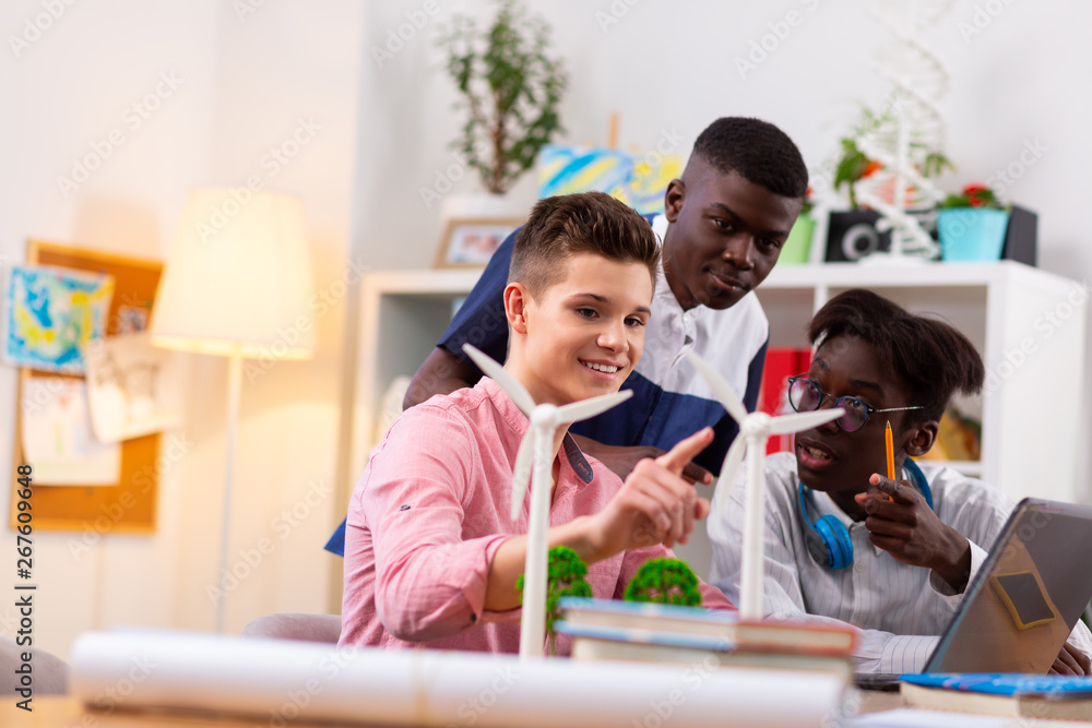Dark-skinned teenagers and their best friend studying together Dark-skinned teenagers and their best friend studying together