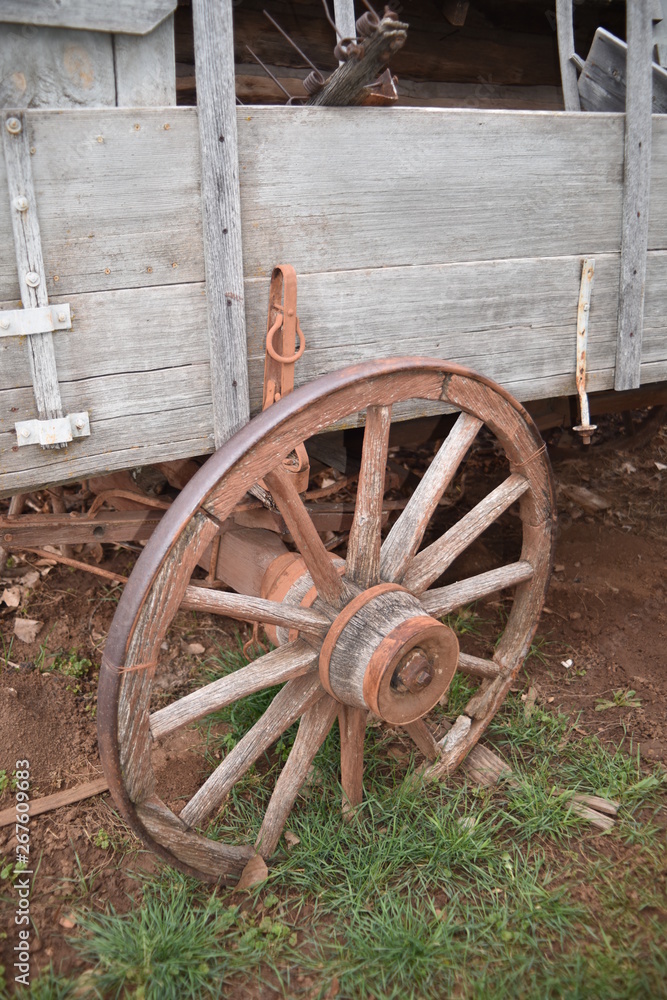Vintage log and sod roof barn and farm equipment and tools