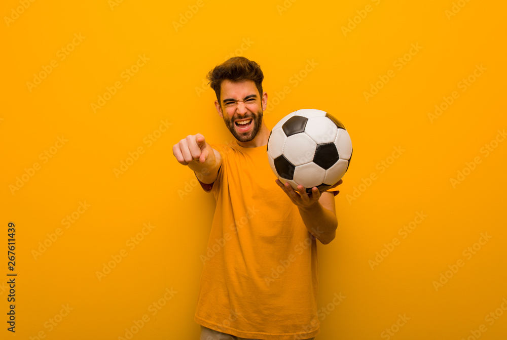 Young soccer player man cheerful and smiling Young soccer player man cheerful and smiling