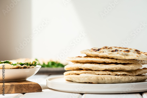 Qutab, azerbaijani flat bread with greens on a light background, a traditional dish.