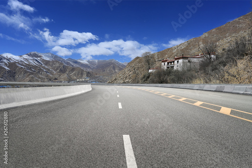 Empty highways and distant mountains photo