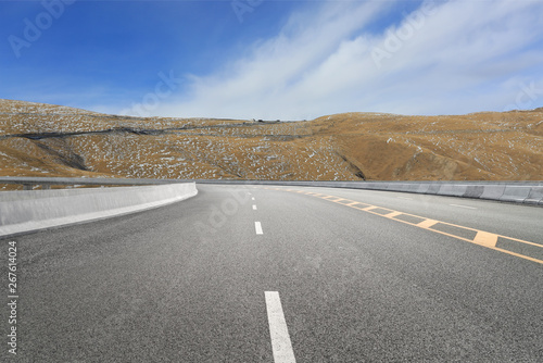 Empty highways and distant mountains photo