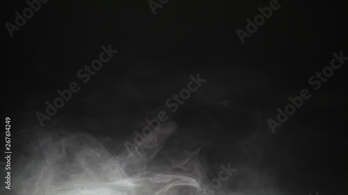 White exploding powder over black background