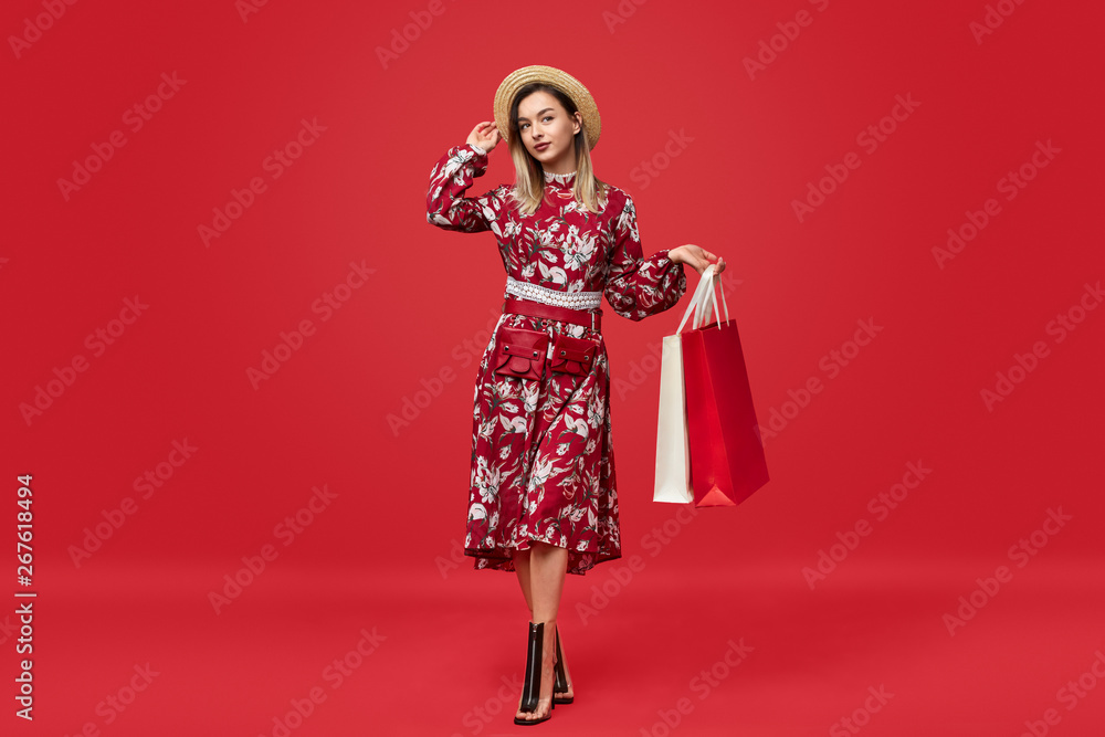 Trendy lady posing with shopping bags Trendy lady posing with shopping bags