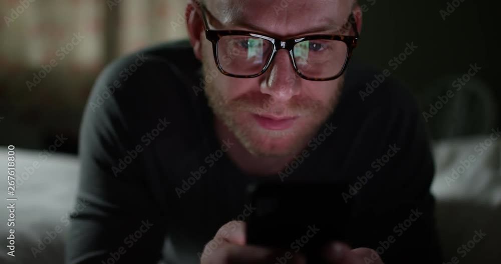 4K Extreme closeup of technology addicted man browsing the web on smartphone. Slow motion. 4K Extreme closeup of technology addicted man browsing the web on smartphone. Slow motion.