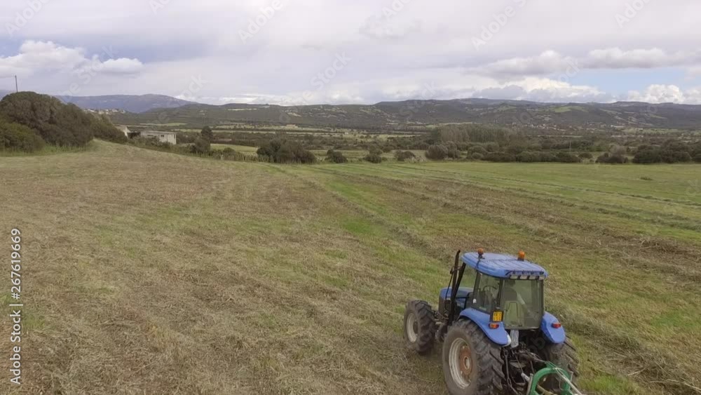 Hay rake tractor turning the hay Hay rake tractor turning the hay