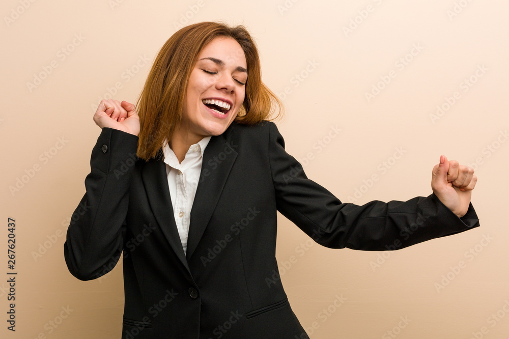 Young caucasian business woman dancing and having fun. Young caucasian business woman dancing and having fun.