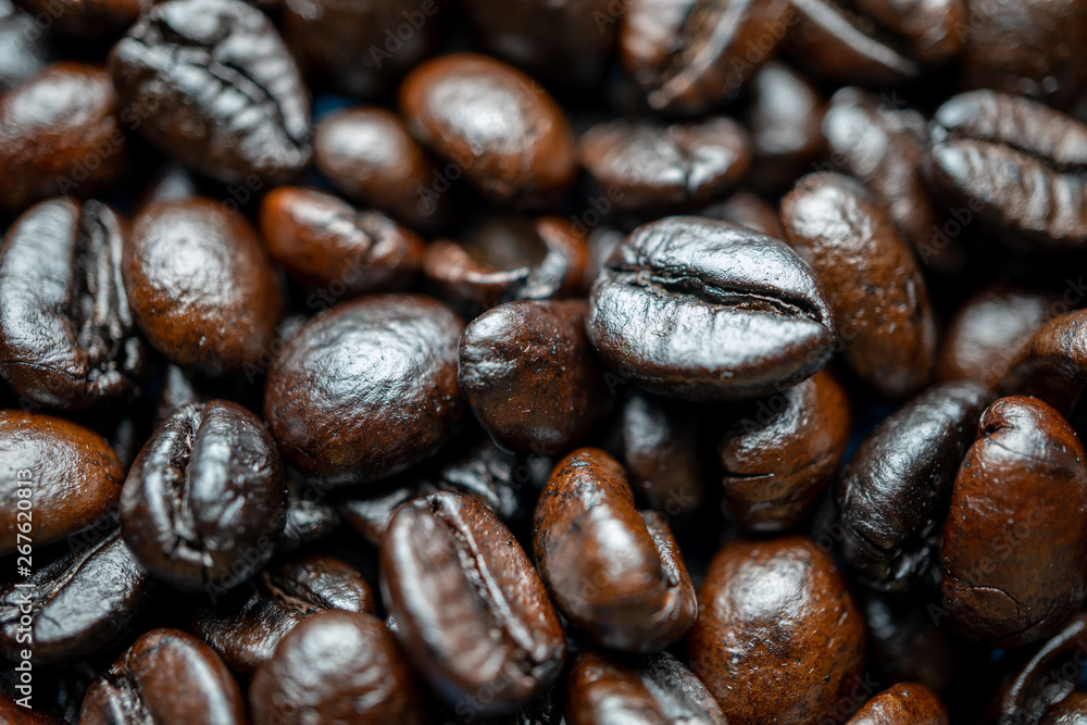 Close up of group black coffee beans. Strong black espresso, Grains of coffee background, texture Close up of group black coffee beans. Strong black espresso, Grains of coffee background, texture