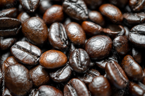 Close up of group black coffee beans. Strong black espresso, Grains of coffee background, texture