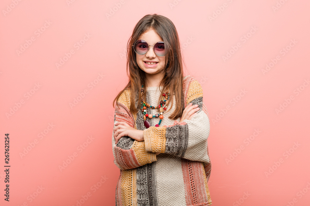 Little hippie girl who feels confident, crossing arms with determination. Little hippie girl who feels confident, crossing arms with determination.
