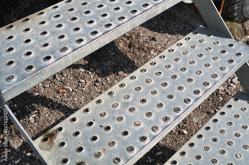 close-up of antislip steps of perforated metal plates photo