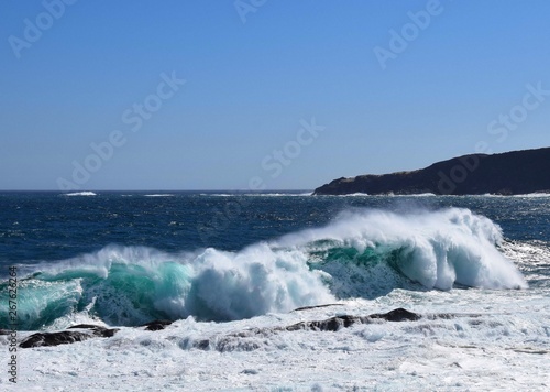 powerful waves hitting the shorleine with a big splash 