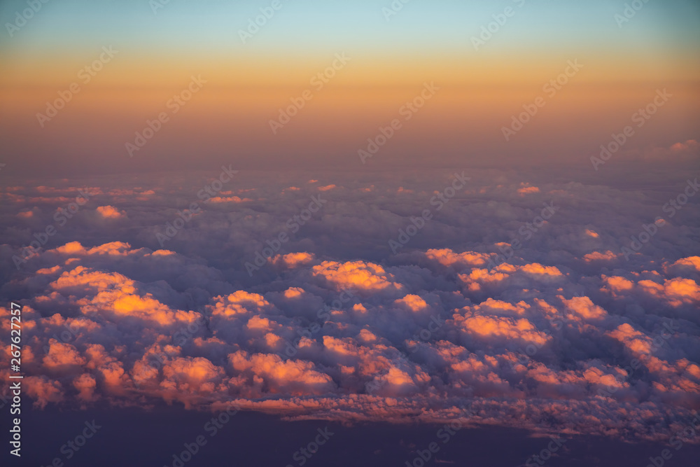 Aerial view from the plane over fluffy clouds Aerial view from the plane over fluffy clouds