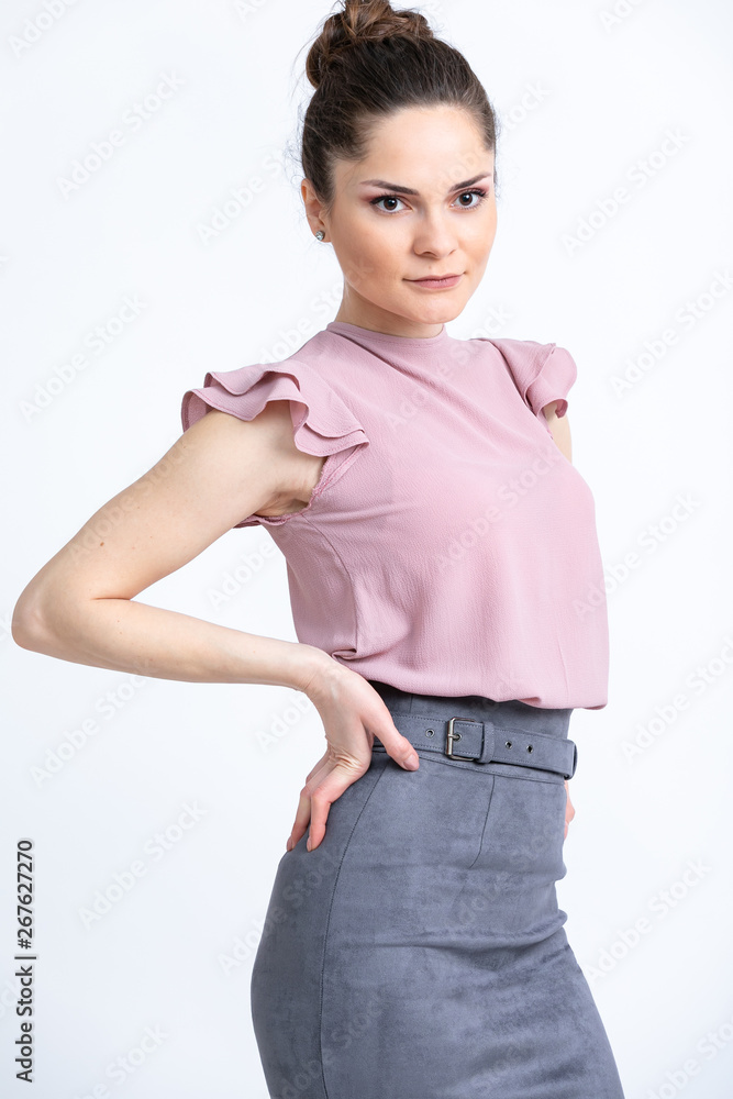 Model in purple blouse, grey suede skirt with belt, isolated on white background. Model in purple blouse, grey suede skirt with belt, isolated on white background.