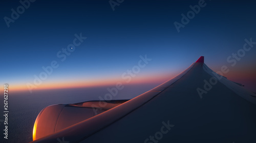 Aerial view from the plane over fluffy clouds © ValentinValkov