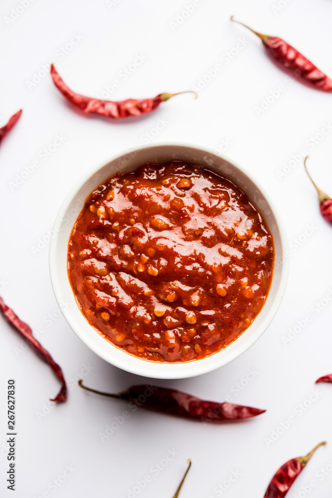 Schezwan Sauce / Szechuan chutney is an important ingredient in Chinese recipe. served in a bowl, isolated. selective focus Schezwan Sauce / Szechuan chutney is an important ingredient in Chinese recipe. served in a bowl, isolated. selective focus