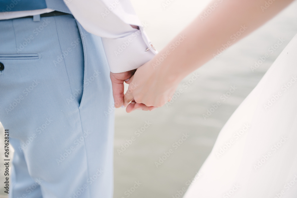 Man and woman hold hands close up