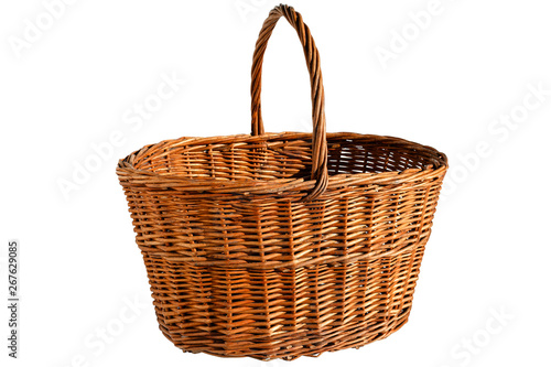Empty wicker basket with a handle isolated on a white background. Preparation for the designer. Front view