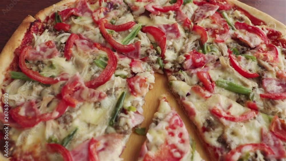 homemade sliced pizza with sausage tomatoes cheese sauce panning shot homemade sliced pizza with sausage tomatoes cheese sauce panning shot