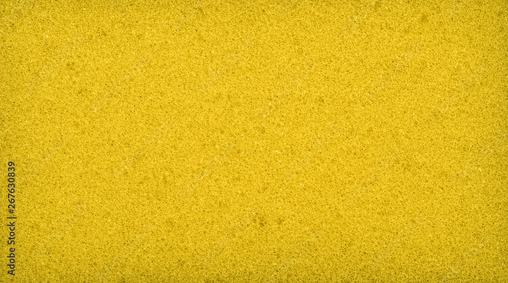 Close up yellow color washing pad / Sponge texture background / sponge texture background, material texture Close up yellow color washing pad / Sponge texture background / sponge texture background, material texture