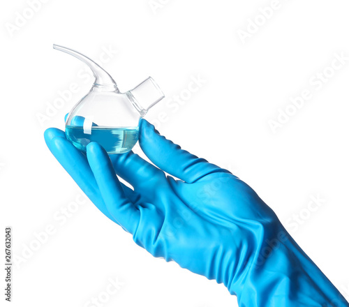 Scientist holding retort with liquid on white background. Chemical research