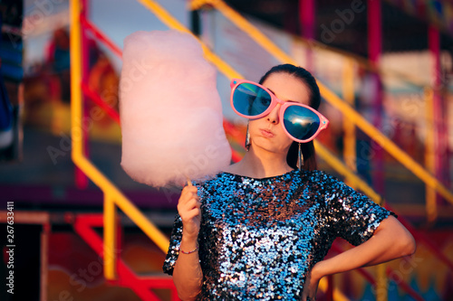 Woman Holding Cotton Candy Dessert in Amusement Park