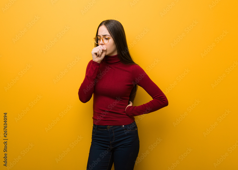 Intellectual young girl coughing, sick due a virus or infection Intellectual young girl coughing, sick due a virus or infection