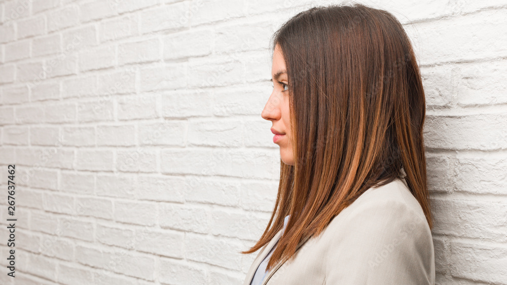 Young business woman on the side looking to front Young business woman on the side looking to front