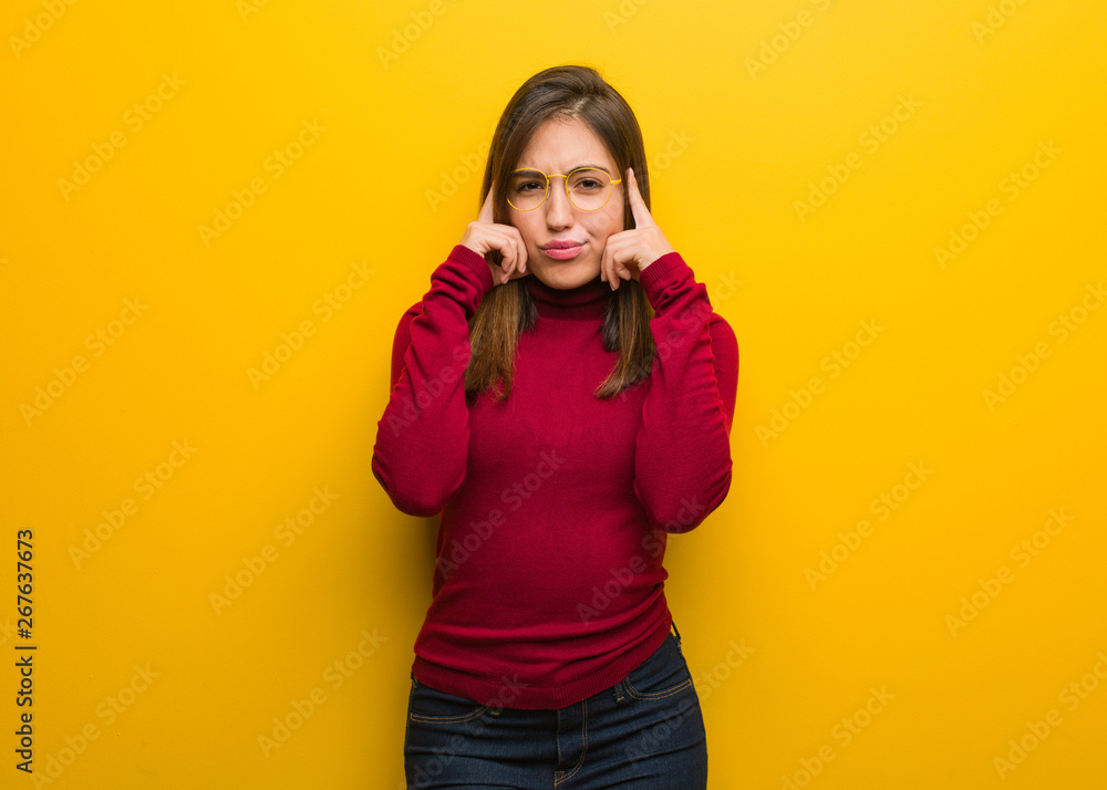 Young intellectual woman doing a concentration gesture Young intellectual woman doing a concentration gesture