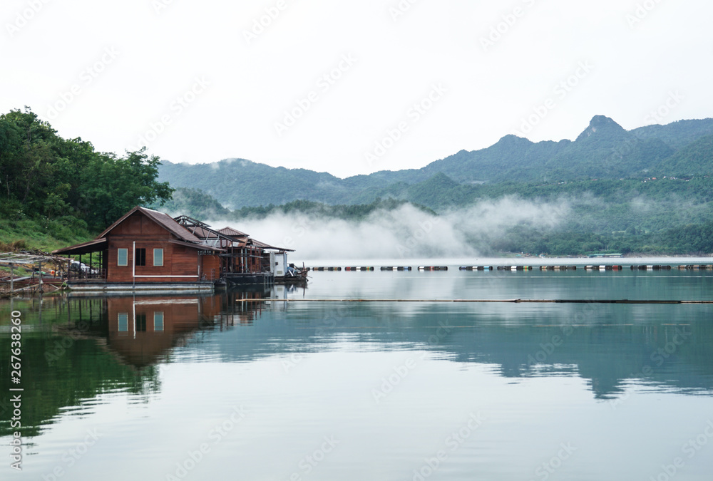 Obraz premium renovate, under construction wooden floating raft house resort by mountain Kanchanaburi Thailand
