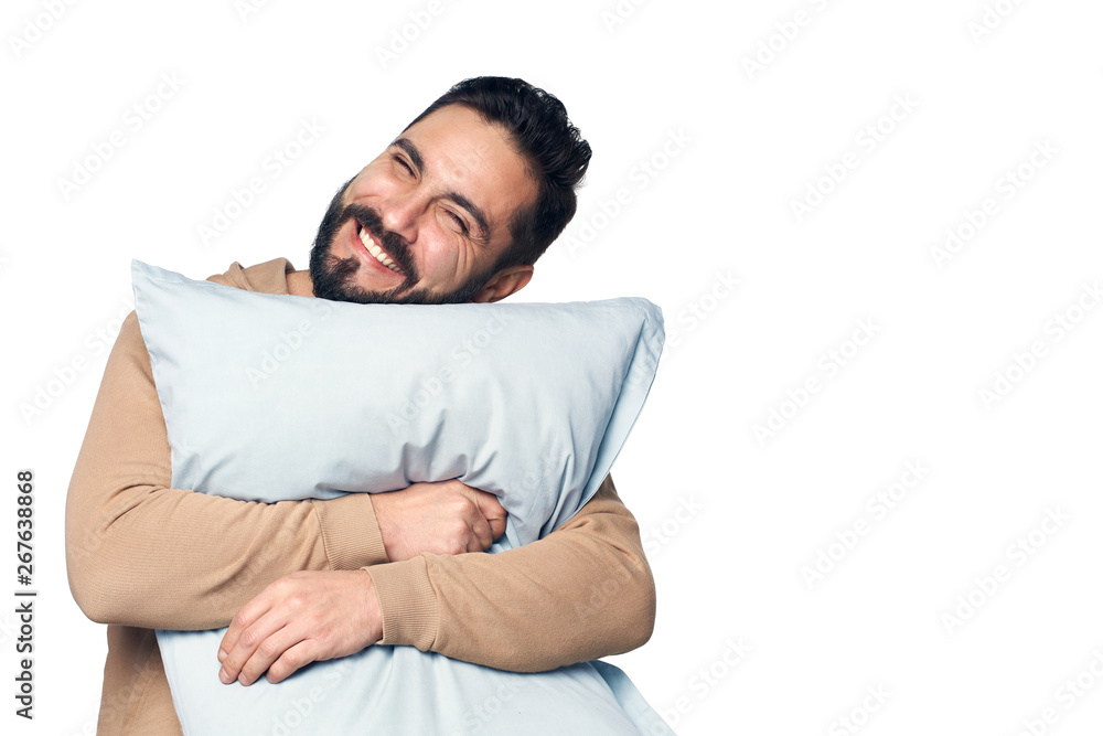 Man in home clothes hugging pillow Stock Photo | Adobe Stock