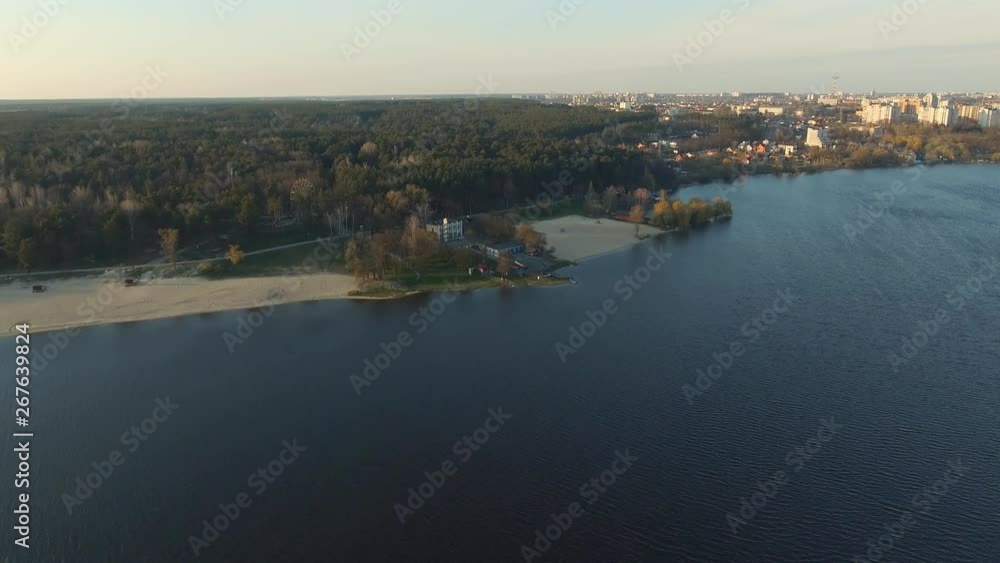 Endless expanses and azure sky. Picturesque exciting wide river water and pine coniferous forest landscape in the city. Natural resources and environment. Aerial survey drone view Endless expanses and azure sky. Picturesque exciting wide river water and pine coniferous forest landscape in the city. Natural resources and environment. Aerial survey drone view
