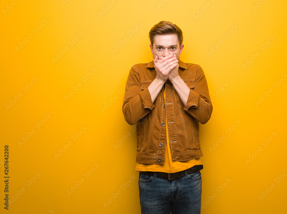 Fototapeta premium Young redhead man surprised and shocked